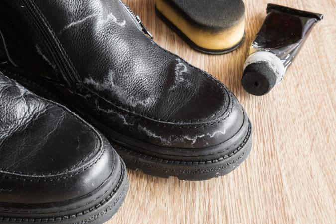 mens black shoes damaged from salt stains