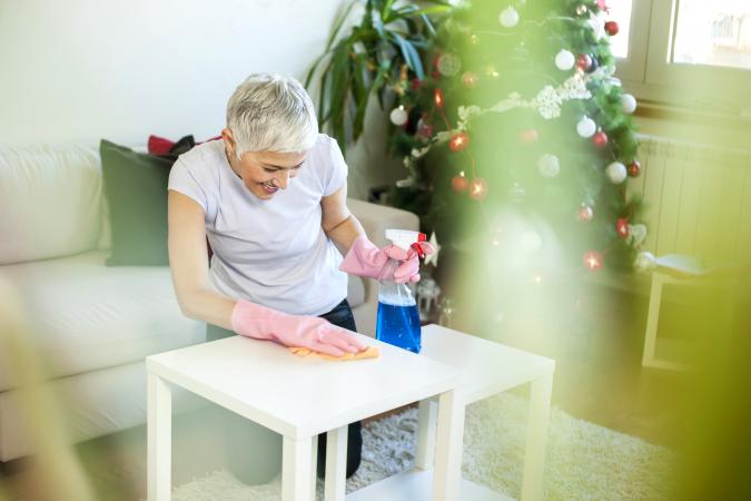 Woman cleaning house for Christmas