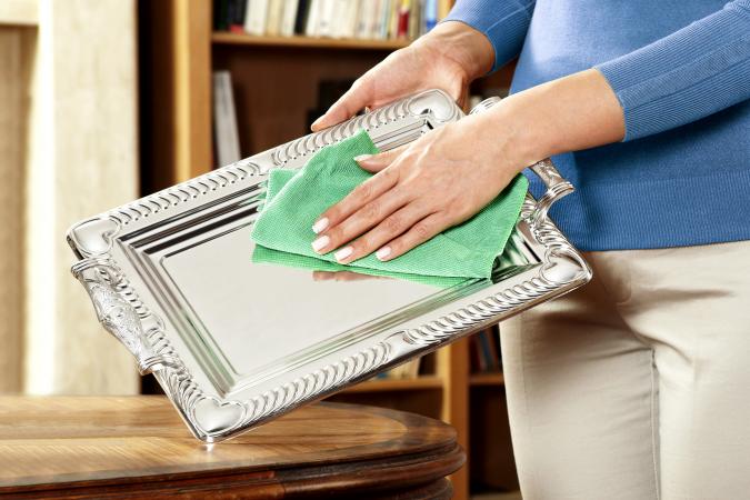 Woman Cleaning Silverware