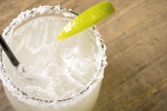 Margarita in a glass with a slice of lime and a salt-coated rim