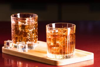 Rum glasses with ice in a lounge bar