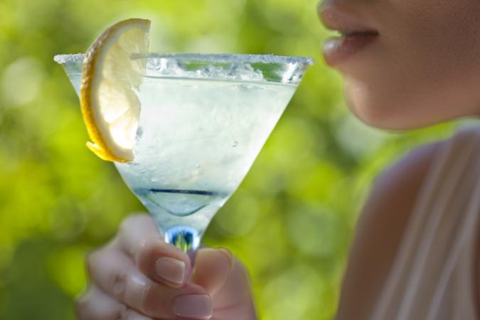 Woman holding glass of margarita