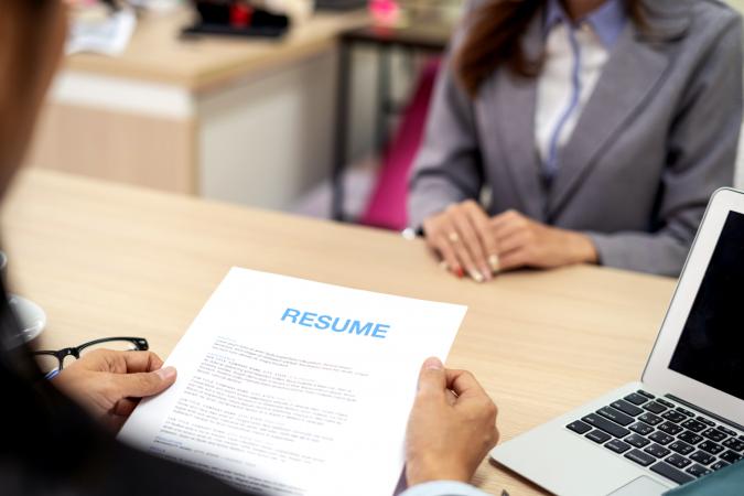 HR Manager interviewing resume of Candidate