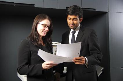 Two young professionals in an office