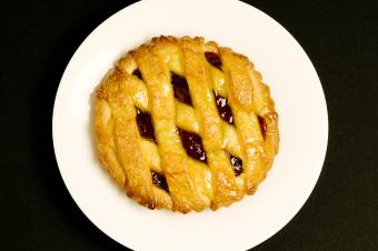 Lattice top prune pie on plate