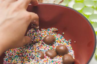 Rolling truffles in rainbow sprinkles