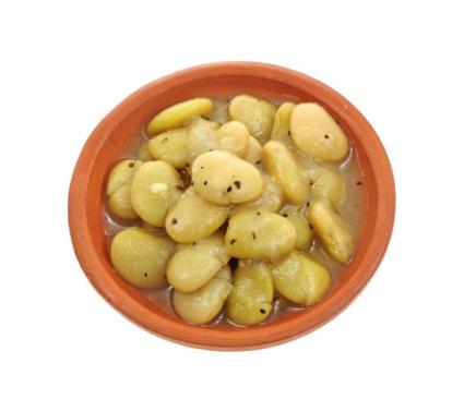Cooked lima beans sprinkled with cracked pepper