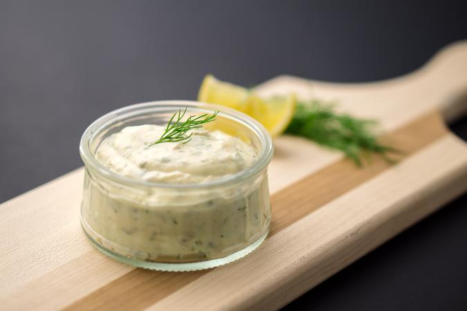 Bowl of tartar sauce on wood