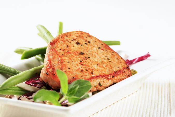 Image of cooked boneless pork chop and veggies