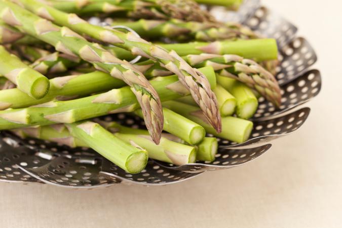 asparagus in a steamer basket