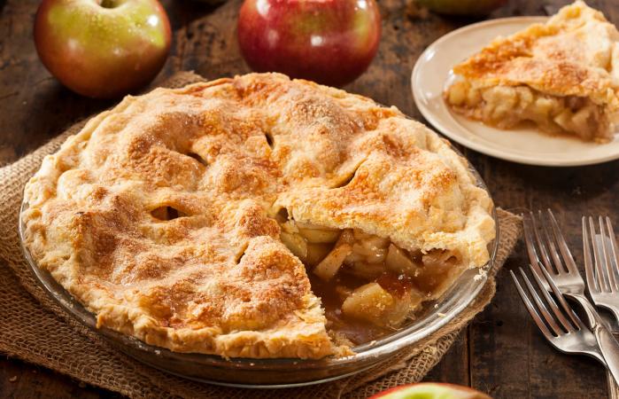 Homemade apple pie sitting on a table