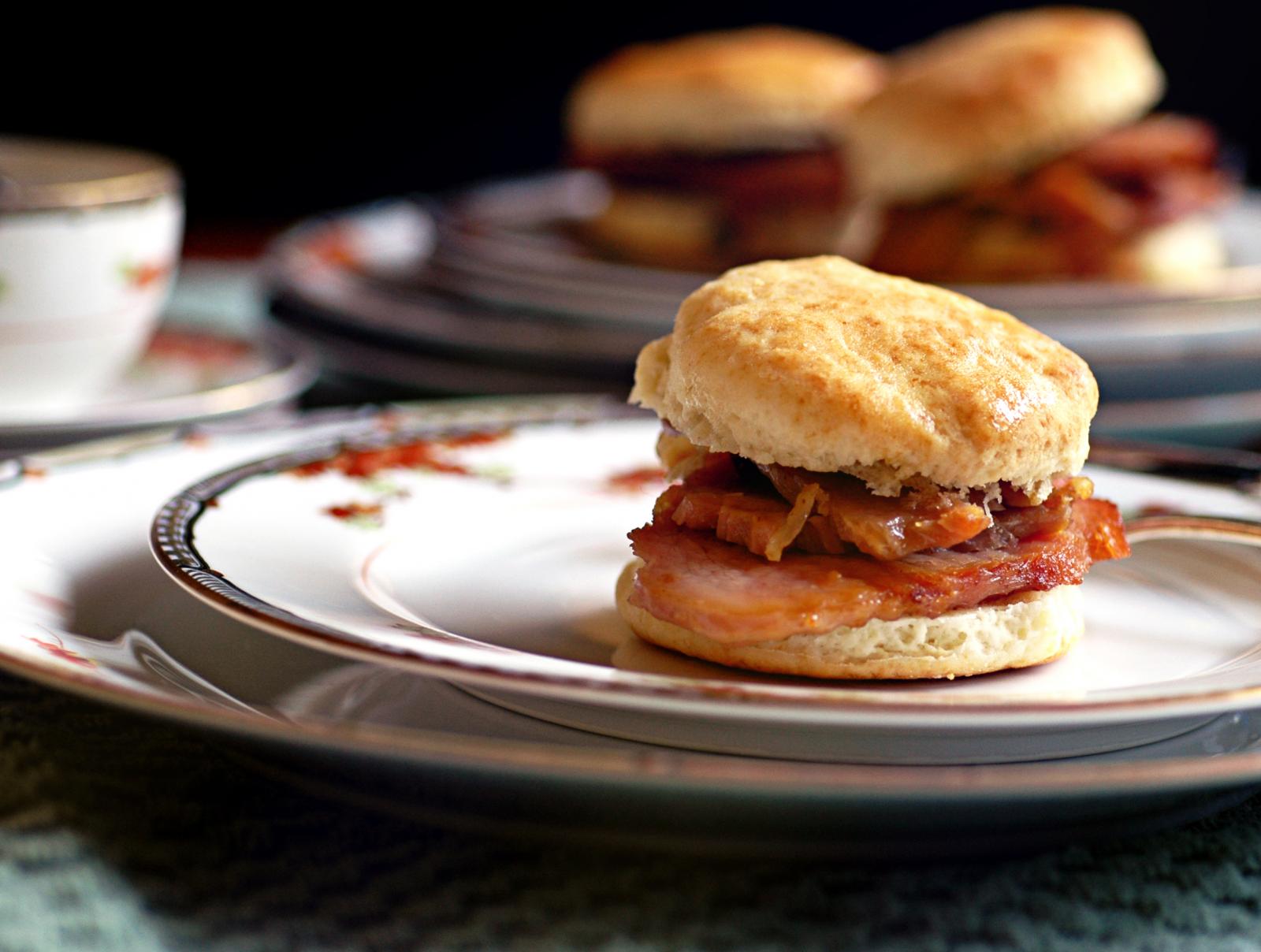 Fresh buttermilk biscuits with country ham on plates