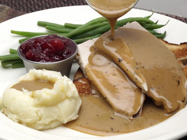 Turkey with gravy, mashed potatoes and green beans