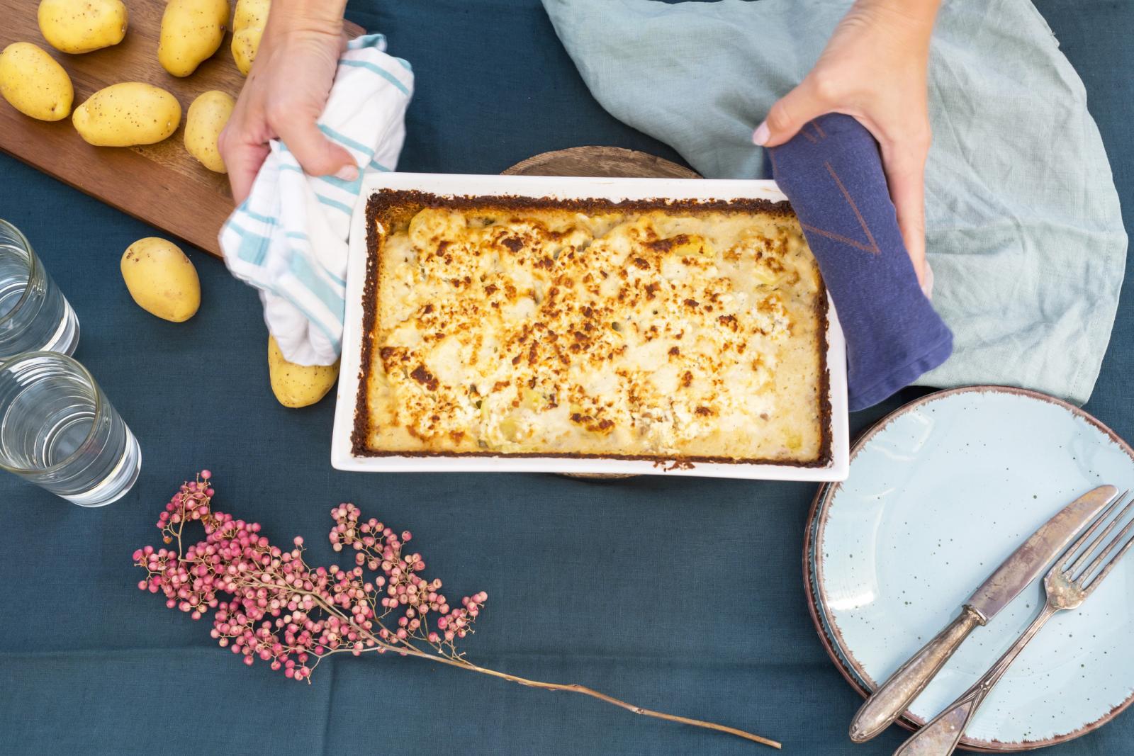 Woman serving turkey casserole