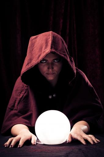 Fortune teller with lit crystal ball