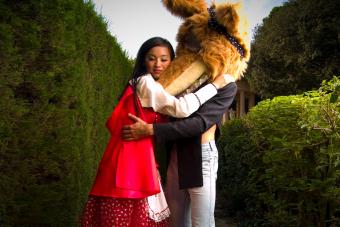 Woman Dressed as Red Riding Hood Hugging