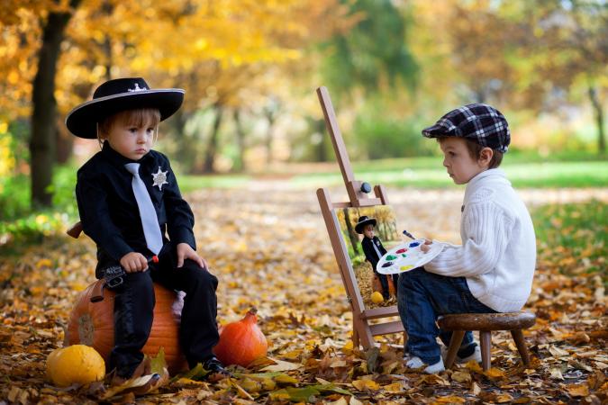 Toddler boys in Halloween costumes