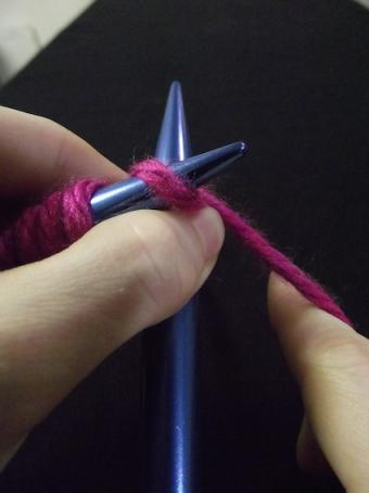 Step five of knitting a knit stitch