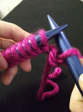 Step eight of knitting a knit stitch