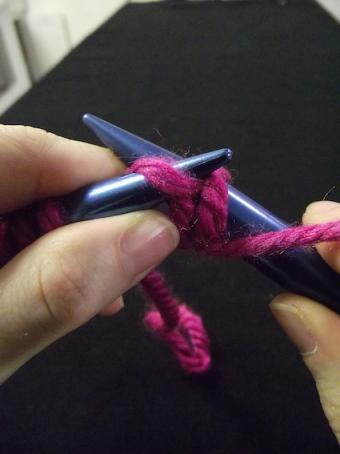 Step four of purling for knitting