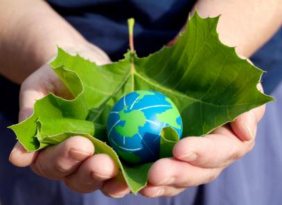 Small hands holding Earth