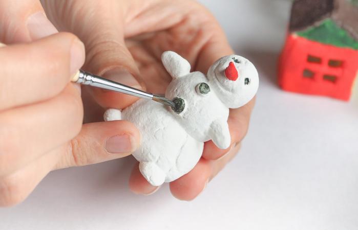 Handmade manufacture of a small toy snowman