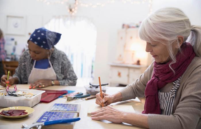 Senior woman enjoying craft class