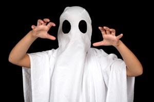Boy dressed as ghost