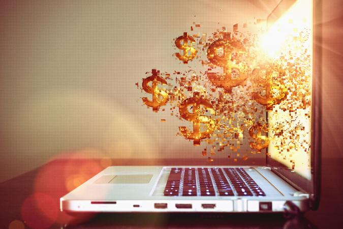 Dollar signs from laptop