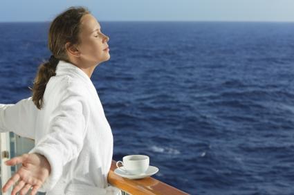 woman with morning coffee on balcony