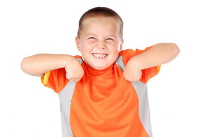 Boy doing the chicken dance; © Nikolay Mamluke | Dreamstime.com