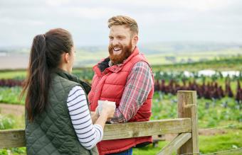 Couple farmers enjoying a hot drink