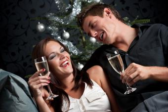 Couple with drinks flirting in bar