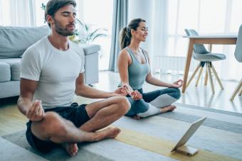 couple meditate at home