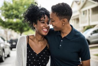 couple walking in residential neighborhood