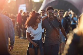 Couple laughing together at big festival