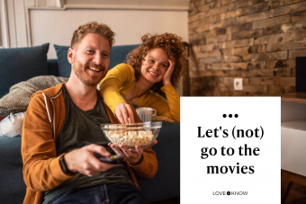 Young couple watching a movie at home