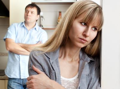 Unhappy couple in kitchen