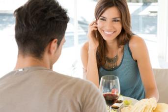 Young man and woman drinking wine on a date