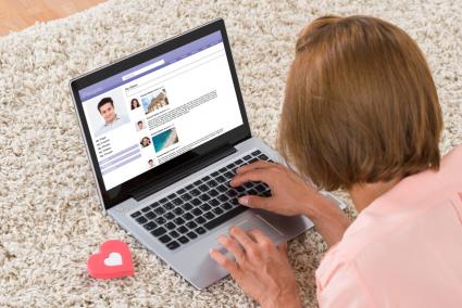 Woman Chatting On Laptop