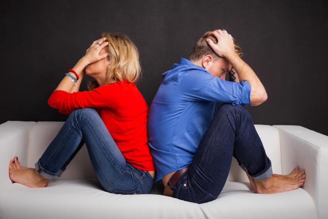 Couple with their backs turned to each other