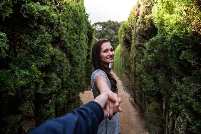 Man holding hand of girlfriend