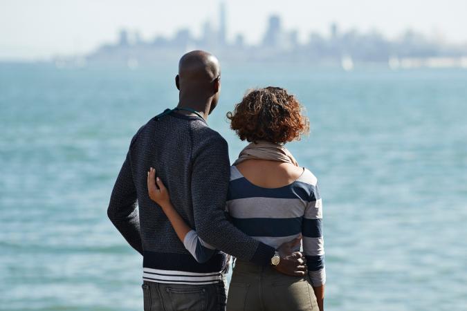 Couple looking at city skyline