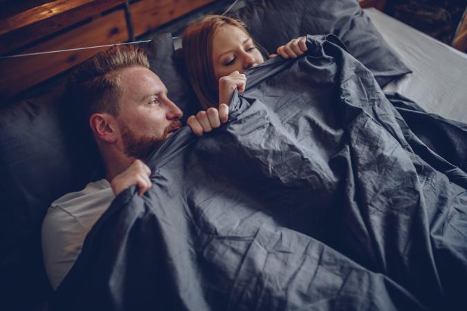 Nervous couple in bed