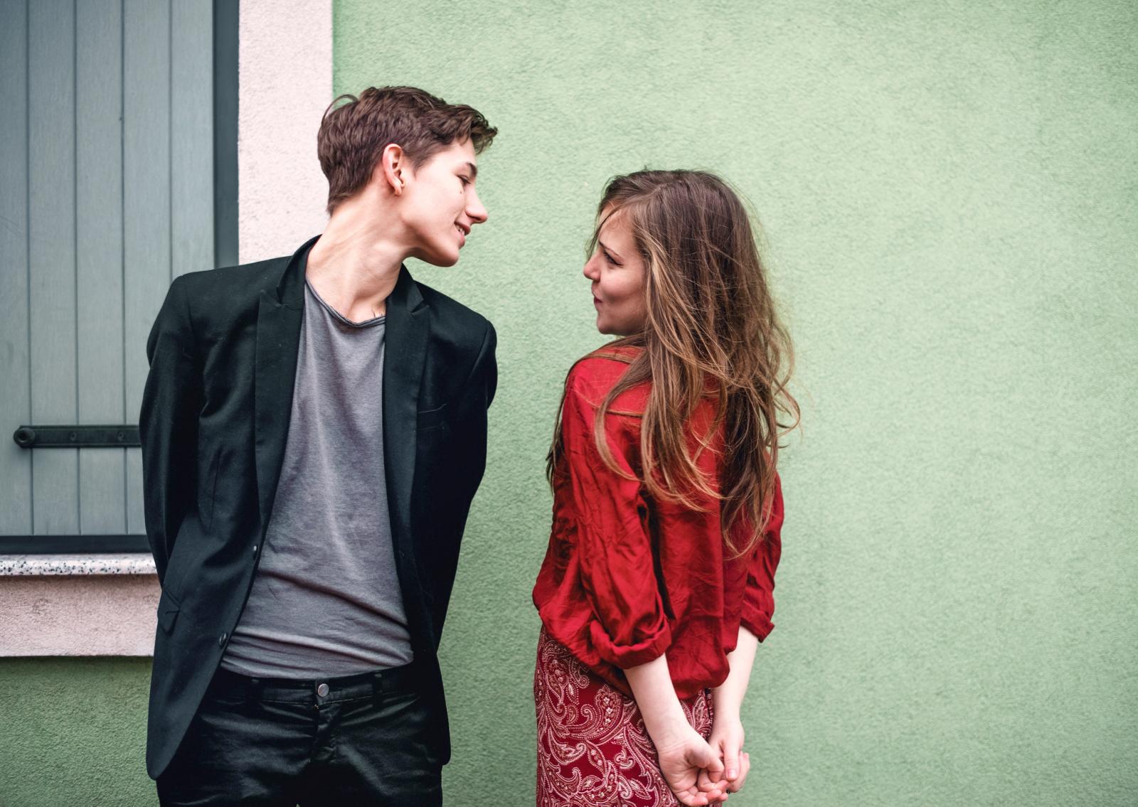 Young boy and girl looking at each other