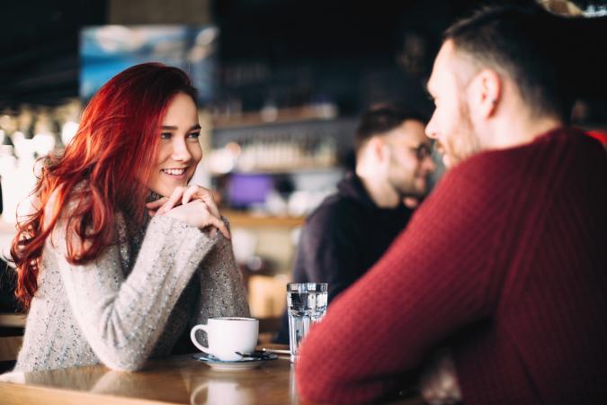 young couple having coffee in restaurant
