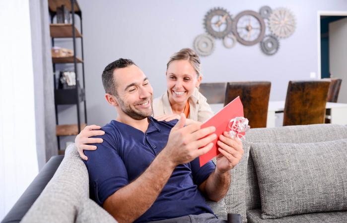 Woman giving gift to her boyfriend