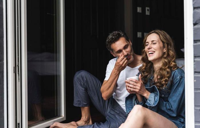 Happy couple in nightwear at home