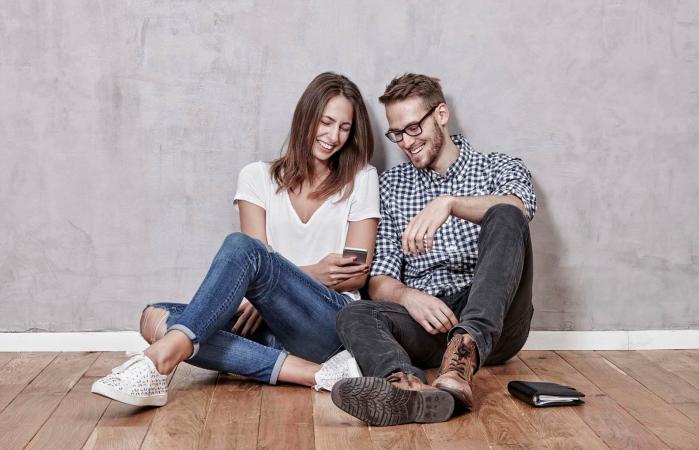 young couple sitting on the floor