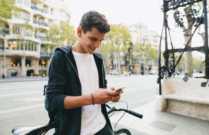 Teen boy texting his girlfriend